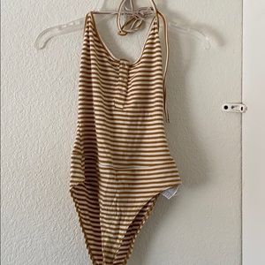 yellow and white stripped body suit